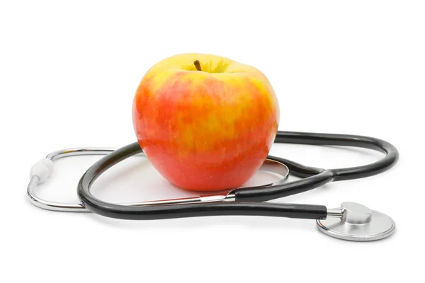 stock image Medical stethoscope and apple