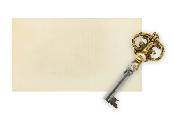 Retro sleutel op papier kaart — Stockfoto
