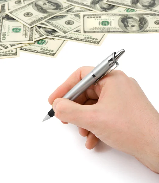 Hand med penna och pengar — Stockfoto