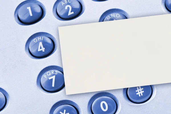 Phone keypad and paper card — Stock Photo, Image