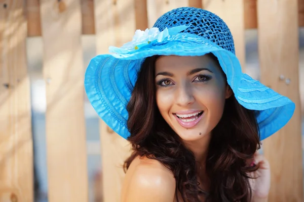 Beautiful female in blue lady's hat — Stock Photo, Image
