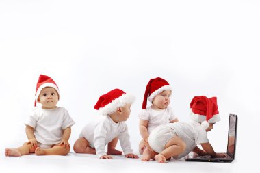 Christmas babies with laptop clipart