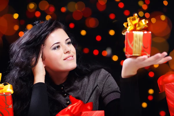 Cute woman with presents at night — Stock Photo, Image