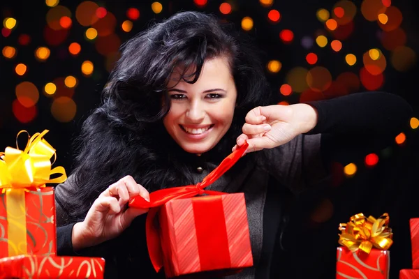 Cute woman with presents at night — Stock Photo, Image