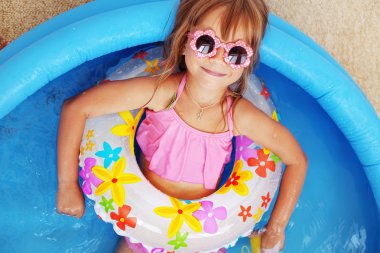 Child in swimming pool clipart