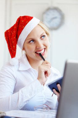 Santa helper working in office clipart