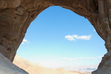 Desert landscape seen from cave clipart