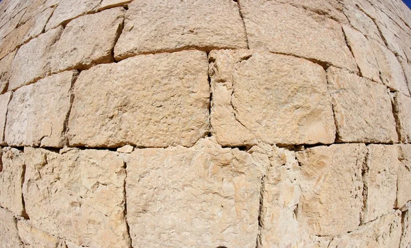 Выпуклая текстура древней каменной стены — стоковое фото