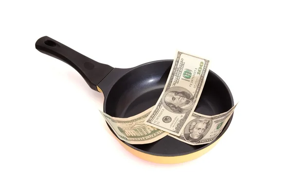 Frying pan with dollar bills isolated — Stock Photo, Image