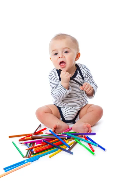 Baby mit Bleistiften — Stockfoto