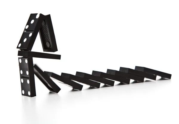 Stack of dominoes falling — Stock Photo, Image