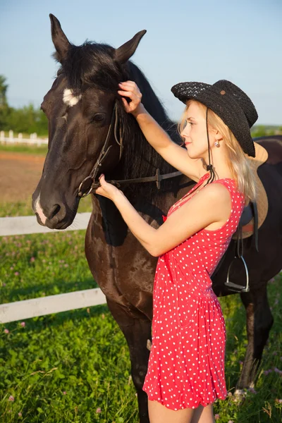 Young blond woman with horse — Stock Photo, Image