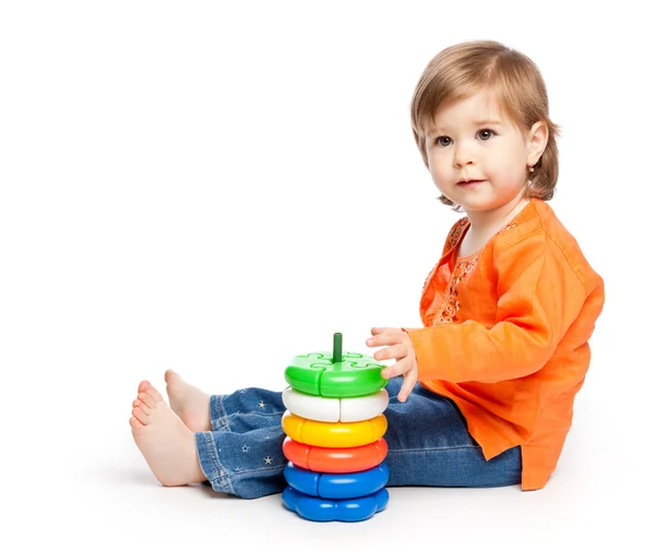 Little girl with toys — Stock Photo, Image
