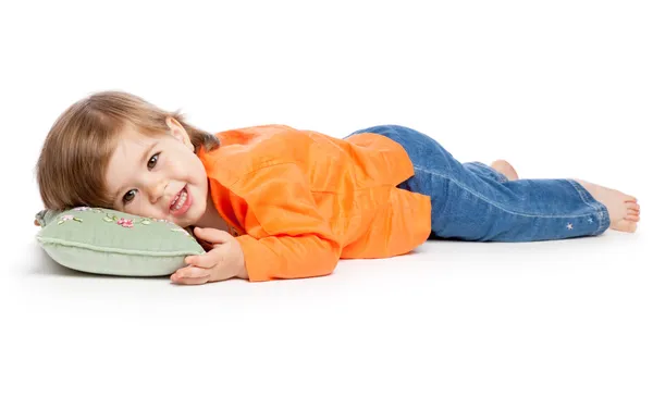 Bambina sdraiata sul cuscino — Foto Stock