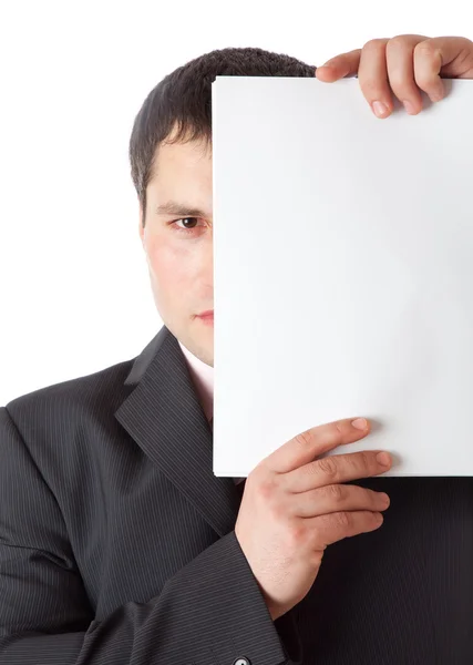 Affärsman nära ögat från papper. isolerad på vit backgro — Stockfoto