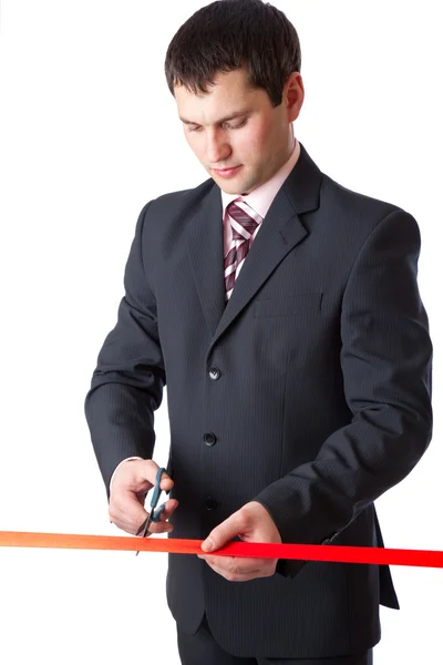 Biznesmen i czerwoną wstążką. na białym tle — Zdjęcie stockowe