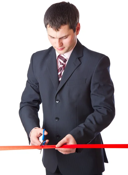 Üzletember és piros szalag. elszigetelt fehér background — Stock Fotó