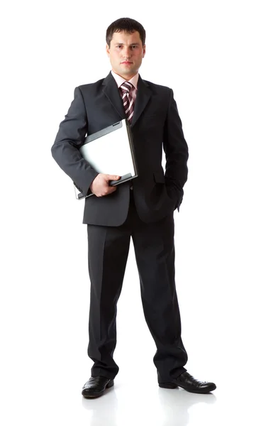 Fiatal üzletember, a laptop. elszigetelt fehér background — Stock Fotó