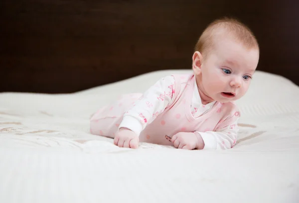 Baby on a bed — Stock Photo, Image