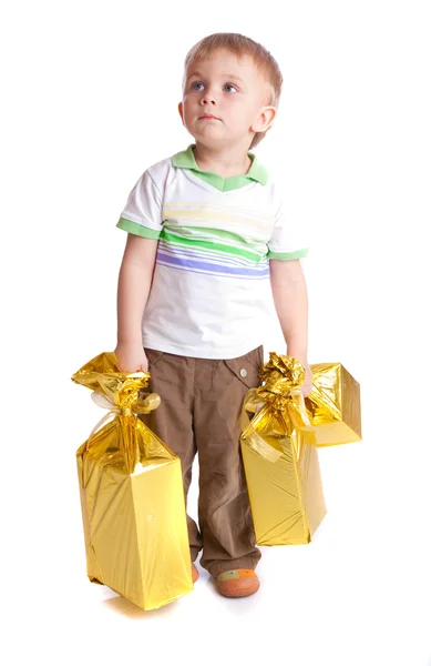 Ребёнок с подарками — стоковое фото