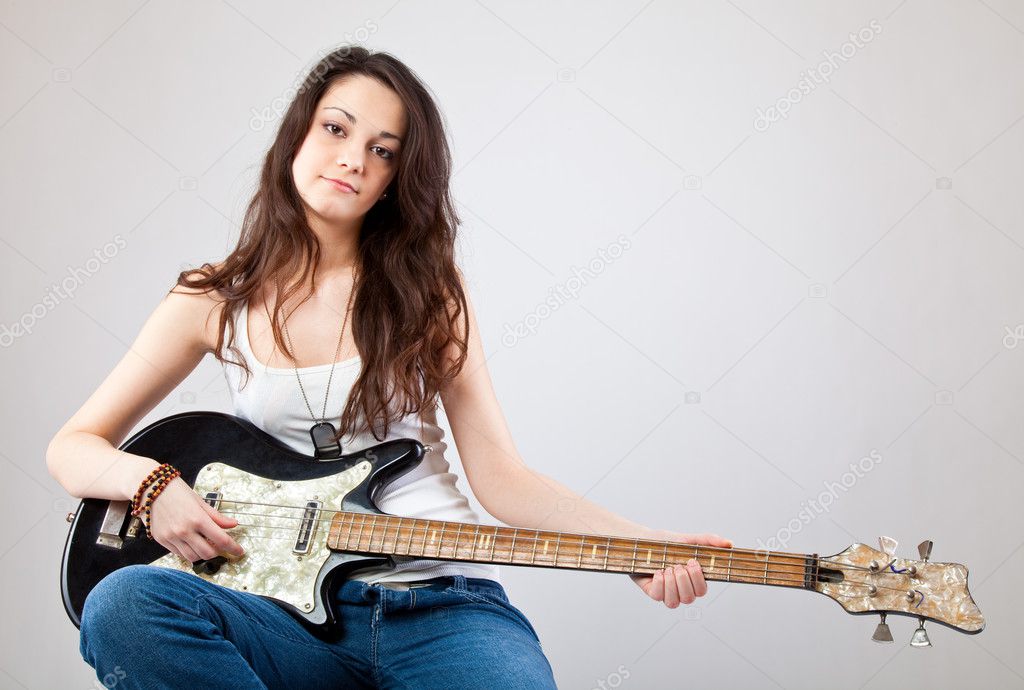 Teenage girl with electric guitar