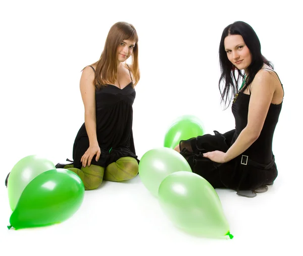 Two young girls with green ballons — Stock Photo, Image