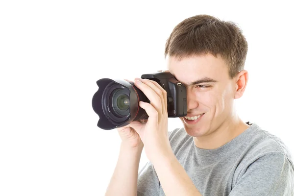 Jovem fotógrafo com câmera — Fotografia de Stock