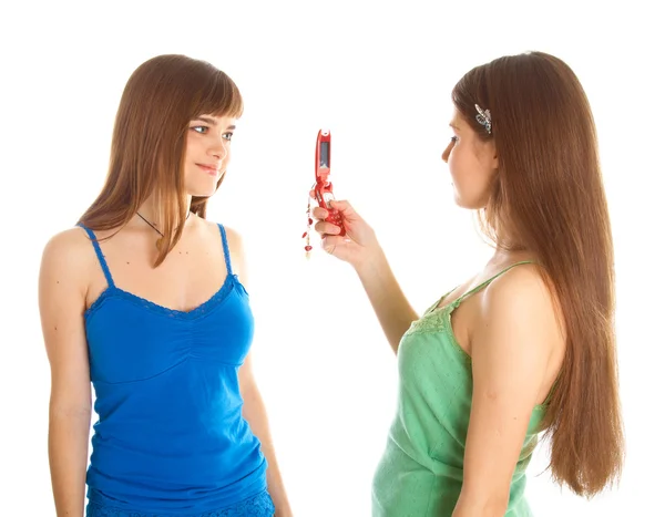 Two teenage girls photographing on mobile phone — Stock Photo, Image