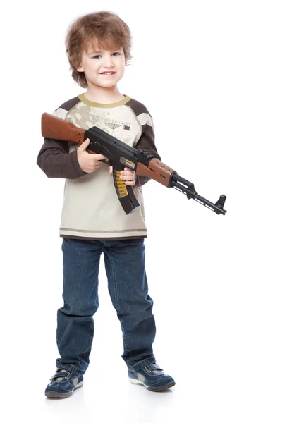 Portrait of little boy with automatic weapon (Kalashnikov) — Stock Photo, Image