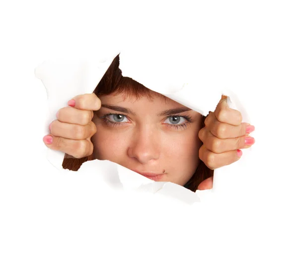Girl is looking through a hole — Stock Photo, Image