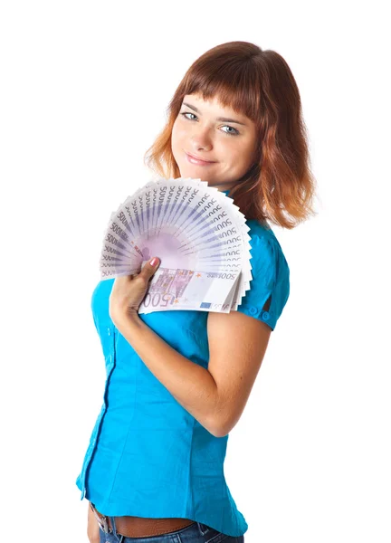 Jeune fille aux cheveux roux avec de l'argent à la main — Photo