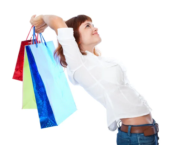 Vermelho de cabelos adolescente-menina com três saco de compras — Fotografia de Stock