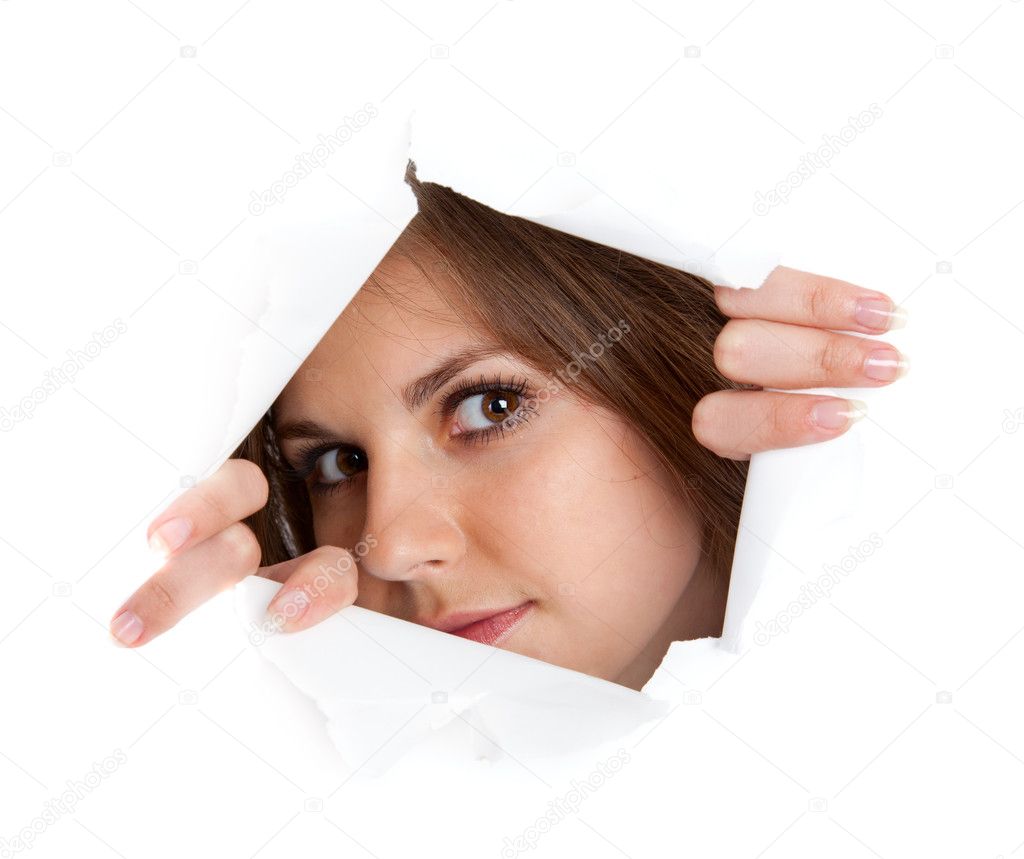 Girl is looking through a hole