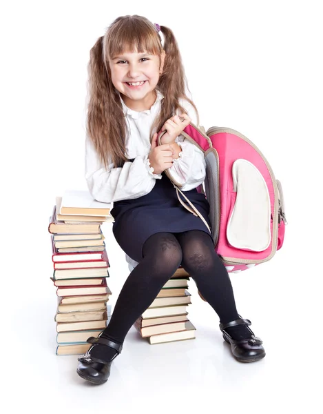 Dziewczyna siedzi na książki — Zdjęcie stockowe