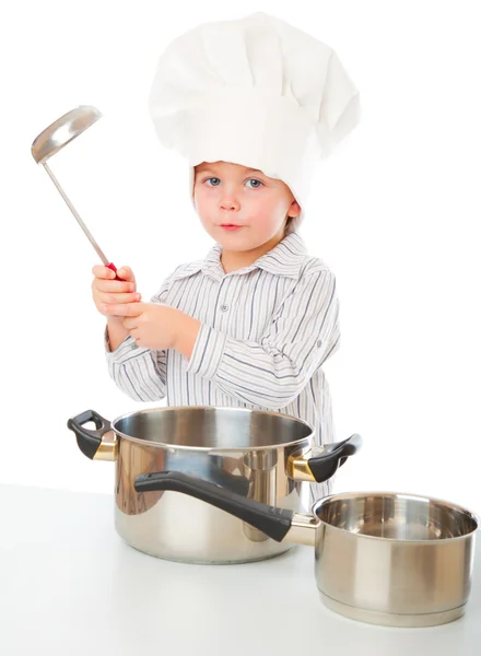 Een grappige jongen is uitbeelden van een kok — Stockfoto