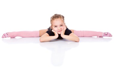 A beautiful girl sits on a splits. isolated on a white background clipart