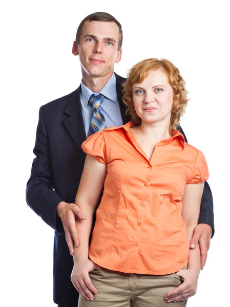 A handsome husband embraces his attractive wife — Stock Photo, Image