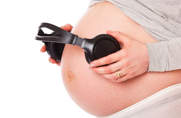 Una Panza Mujer Embarazada Con Auriculares Aislado Sobre Fondo Blanco —  Fotos de Stock