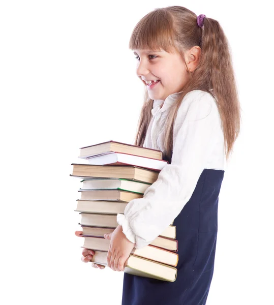 Ένα χαμογελαστό κορίτσι με ένα τεράστιο σωρό των βιβλίων — Φωτογραφία Αρχείου