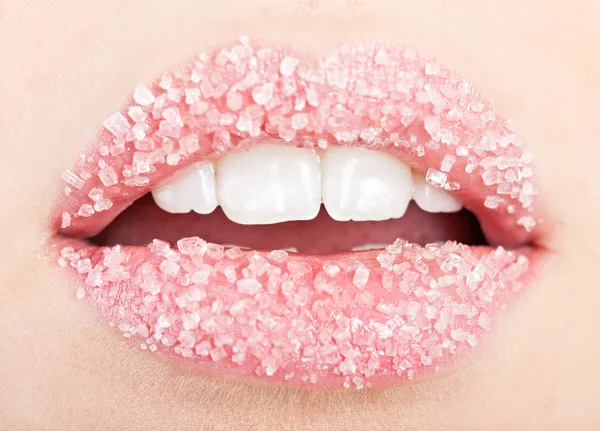 Woman's red lips strewed with sugar — Stock Photo, Image