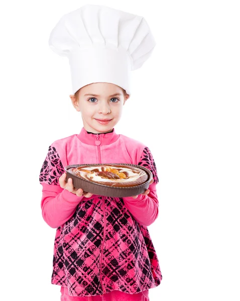 A little girl is holding a plate of pie — Stock Photo, Image
