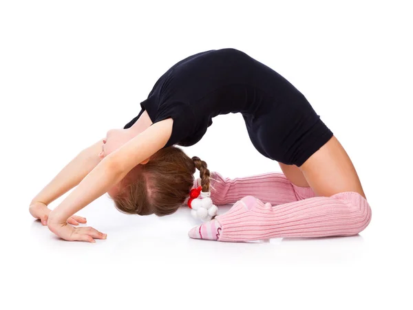 En flicka är engagerade i akrobatik — Stockfoto