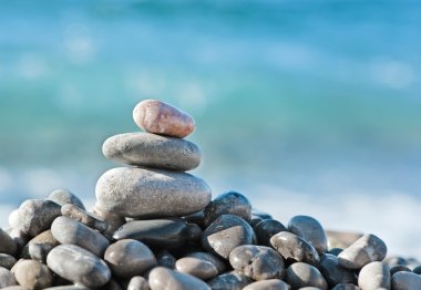 Balanced stones on the sea clipart