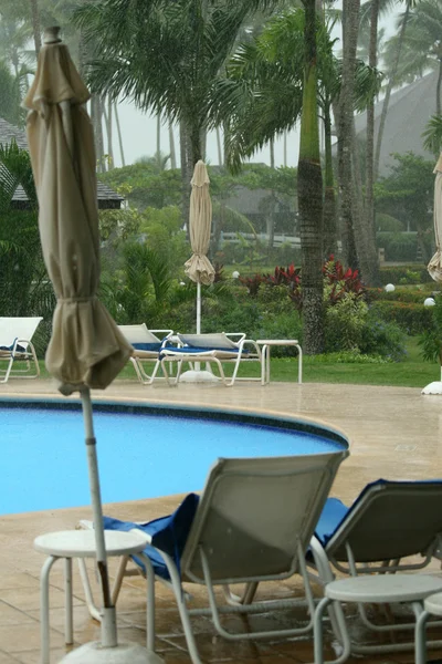 Raining by the swimming pool — Stock Photo, Image