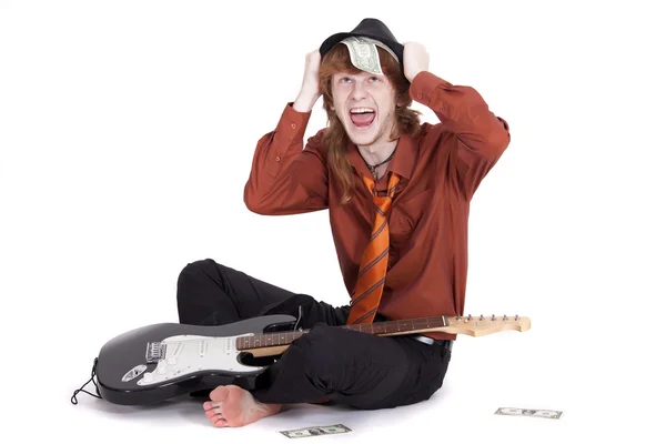 Счастливый музыкант с долларами — стоковое фото