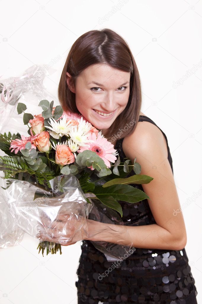 Happy woman holding flowers