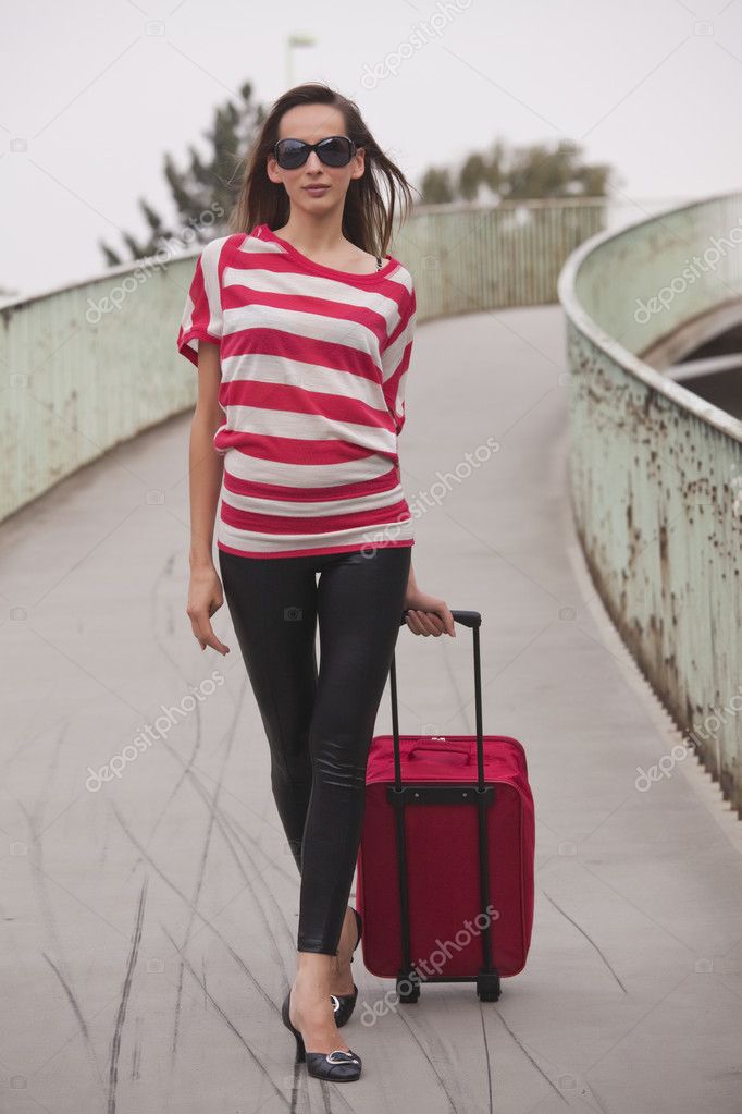 Woman pulling luggage