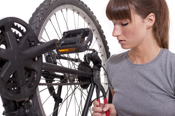 Fixing gear on bicycle with plier — Stock Photo, Image