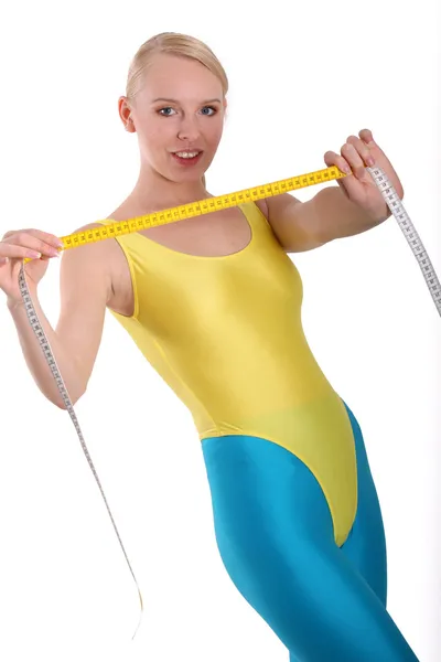 Fitness woman with measuring tape — Stock Photo, Image