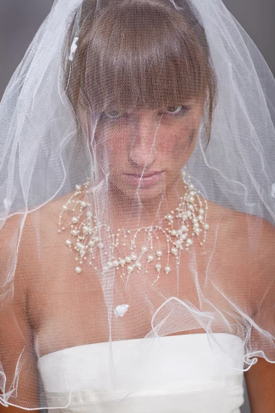 Sad bride under white veil — Stock Photo, Image